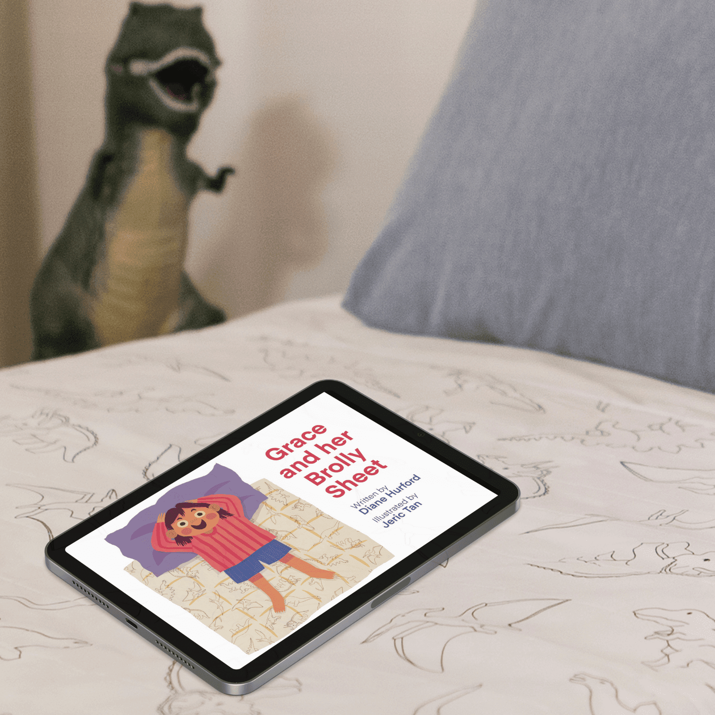 Grace and her brolly sheet e-book on a childs bed on an ipad