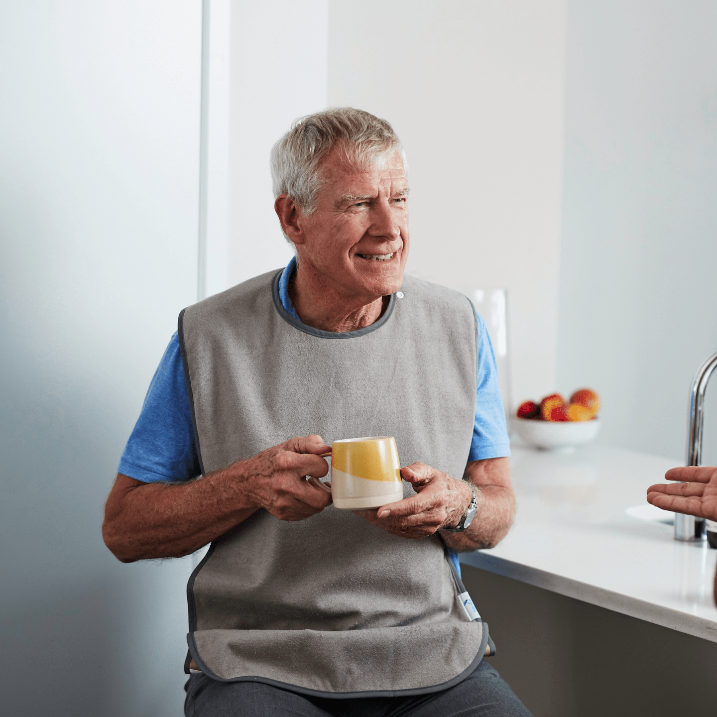 Adult Tray Bib with man having cup of tea