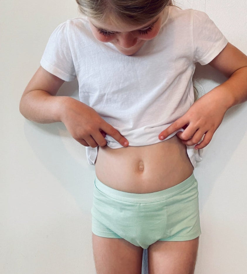 Child wearing Snazzi Pants Night Trainers - Moss Boss