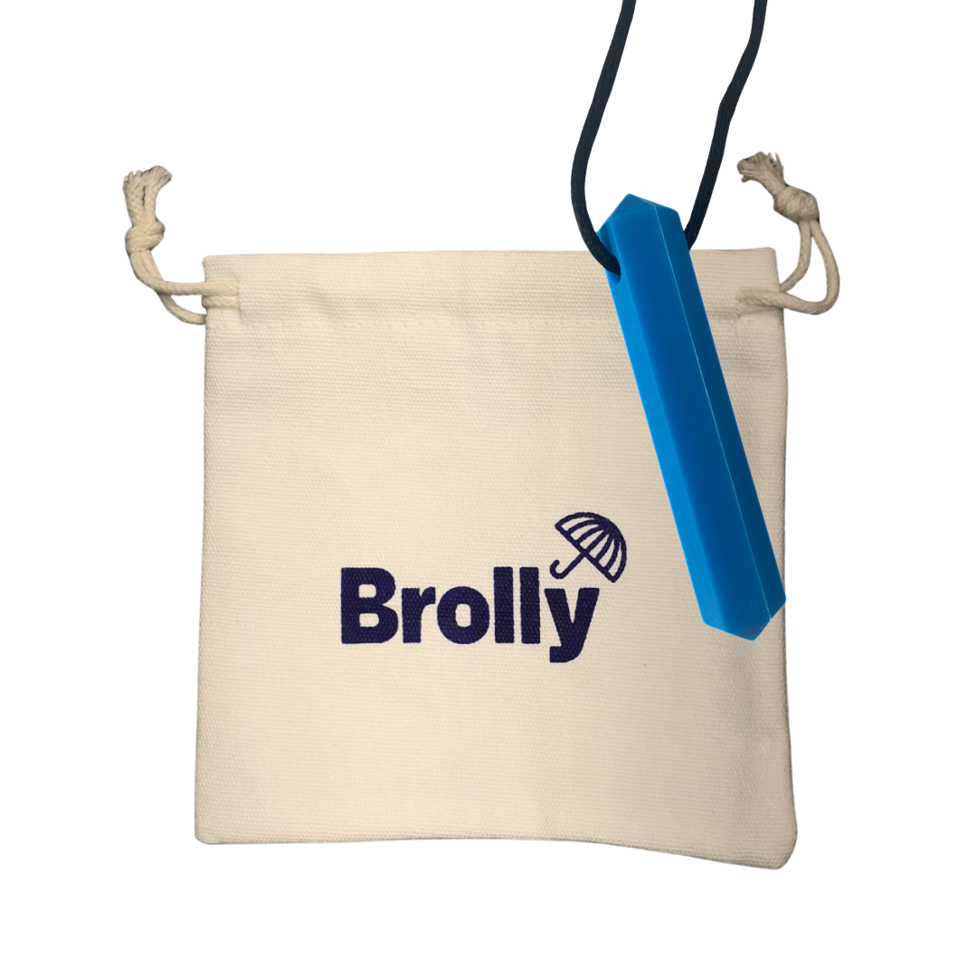 Beige drawstring pouch and hexagon-shaped Brolly Sheet Chew Necklace on a black cord against a white background - Blue