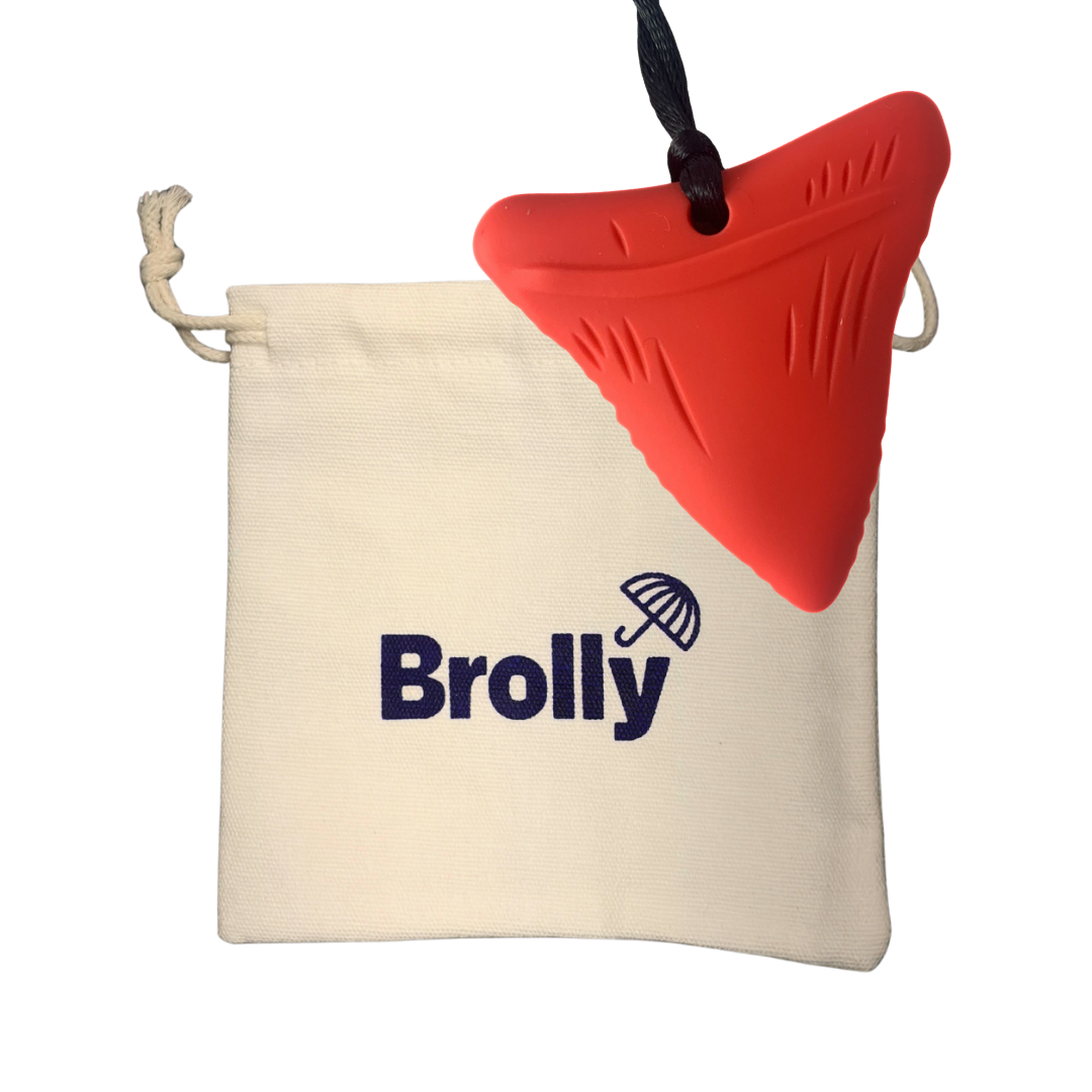 Beige drawstring pouch and Shark Tooth-shaped Brolly Sheet Chew Necklace on a black cord against a white background - Red