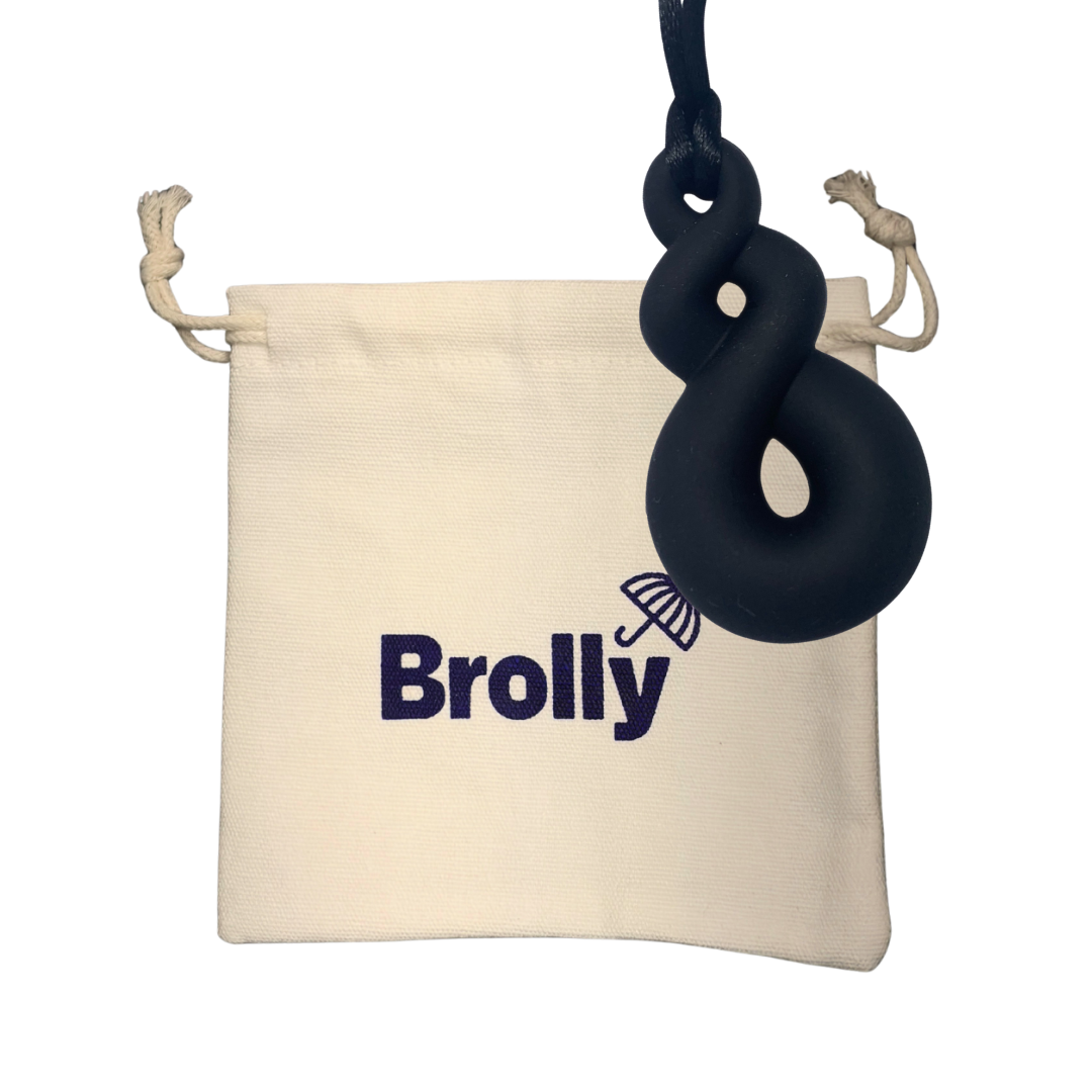 Beige drawstring pouch and Triple Loop-shaped Brolly Sheet Chew Necklace on a black cord against a white background - Black