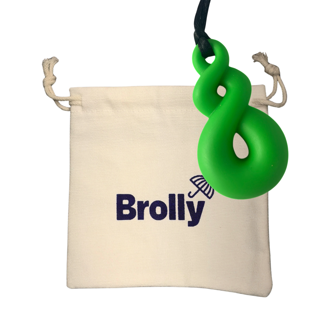 Beige drawstring pouch and Triple Loop-shaped Brolly Sheet Chew Necklace on a black cord against a white background - Green