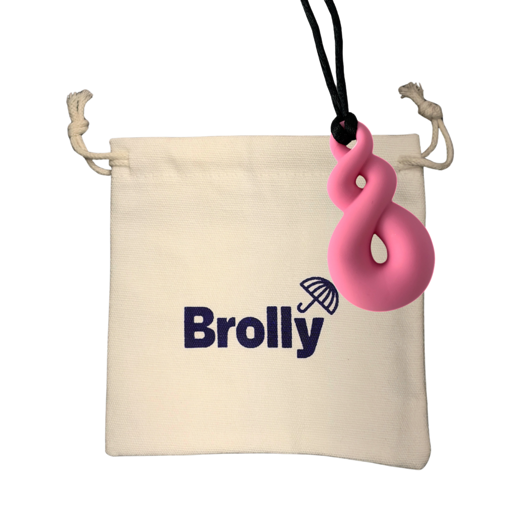 Beige drawstring pouch and Triple Loop-shaped Brolly Sheet Chew Necklace on a black cord against a white background - Pink