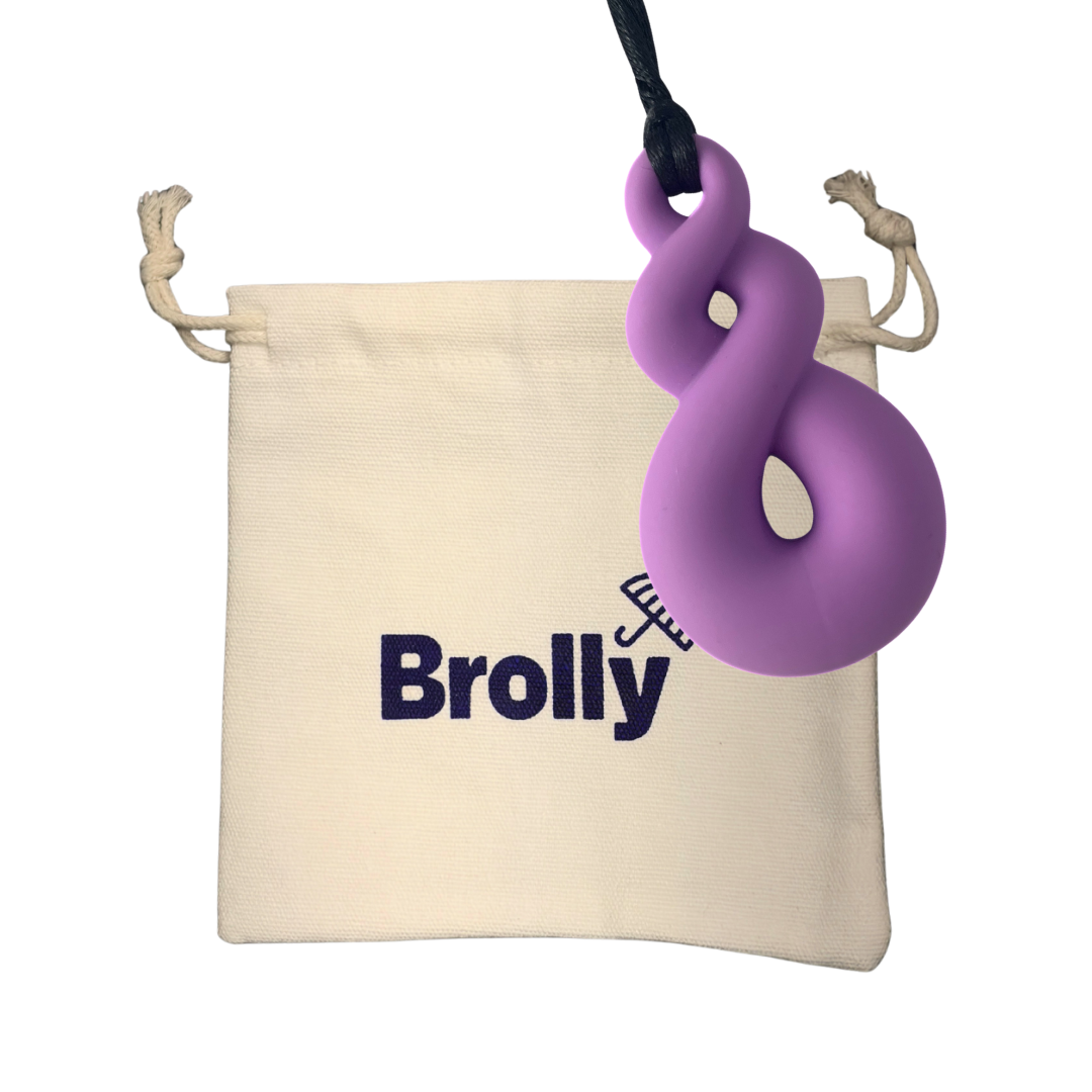 Beige drawstring pouch and Triple Loop-shaped Brolly Sheet Chew Necklace on a black cord against a white background - Purple