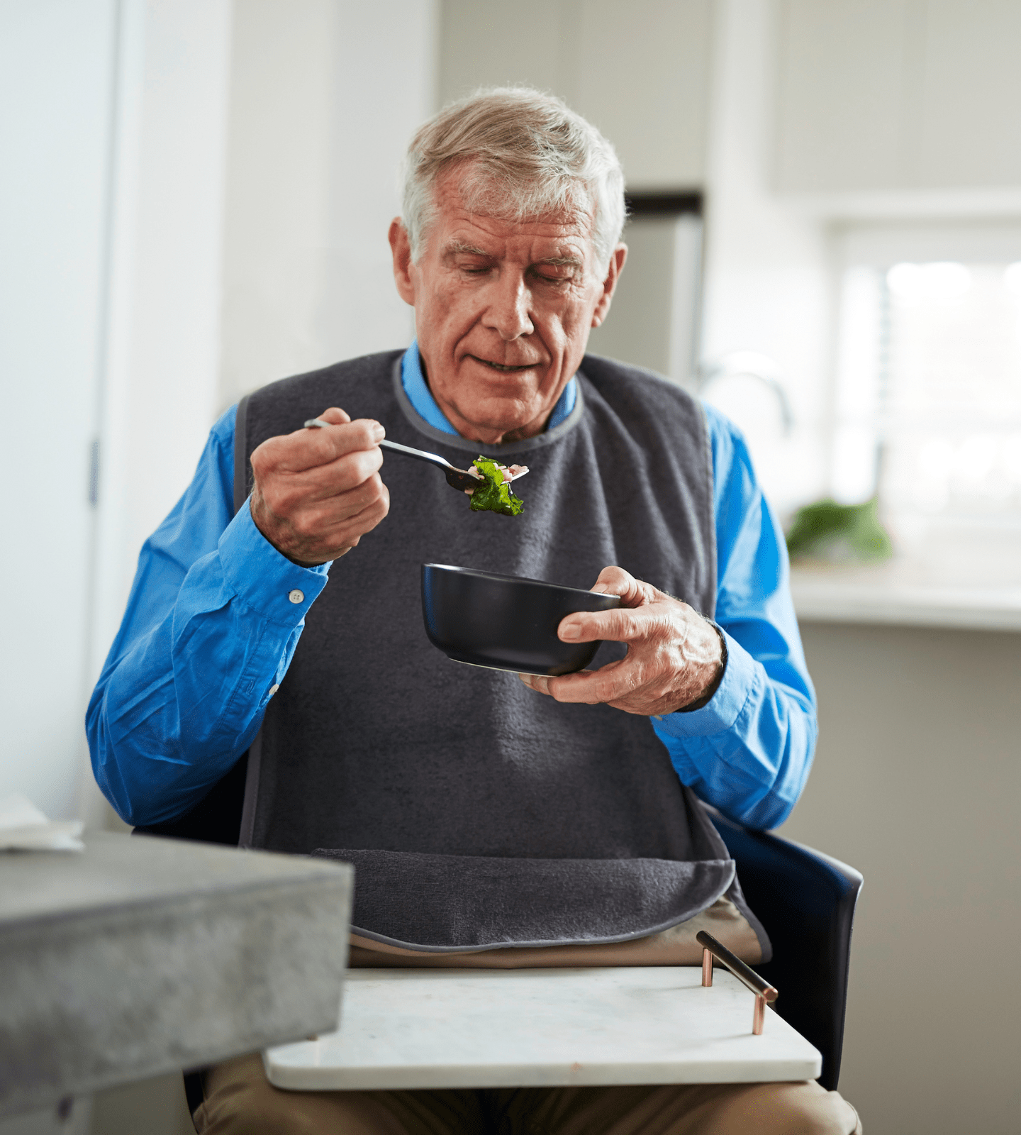 Adult Tray Bib with man eating