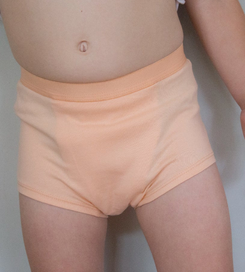 Child wearing Snazzi Pants Nights Trainers - Peachy