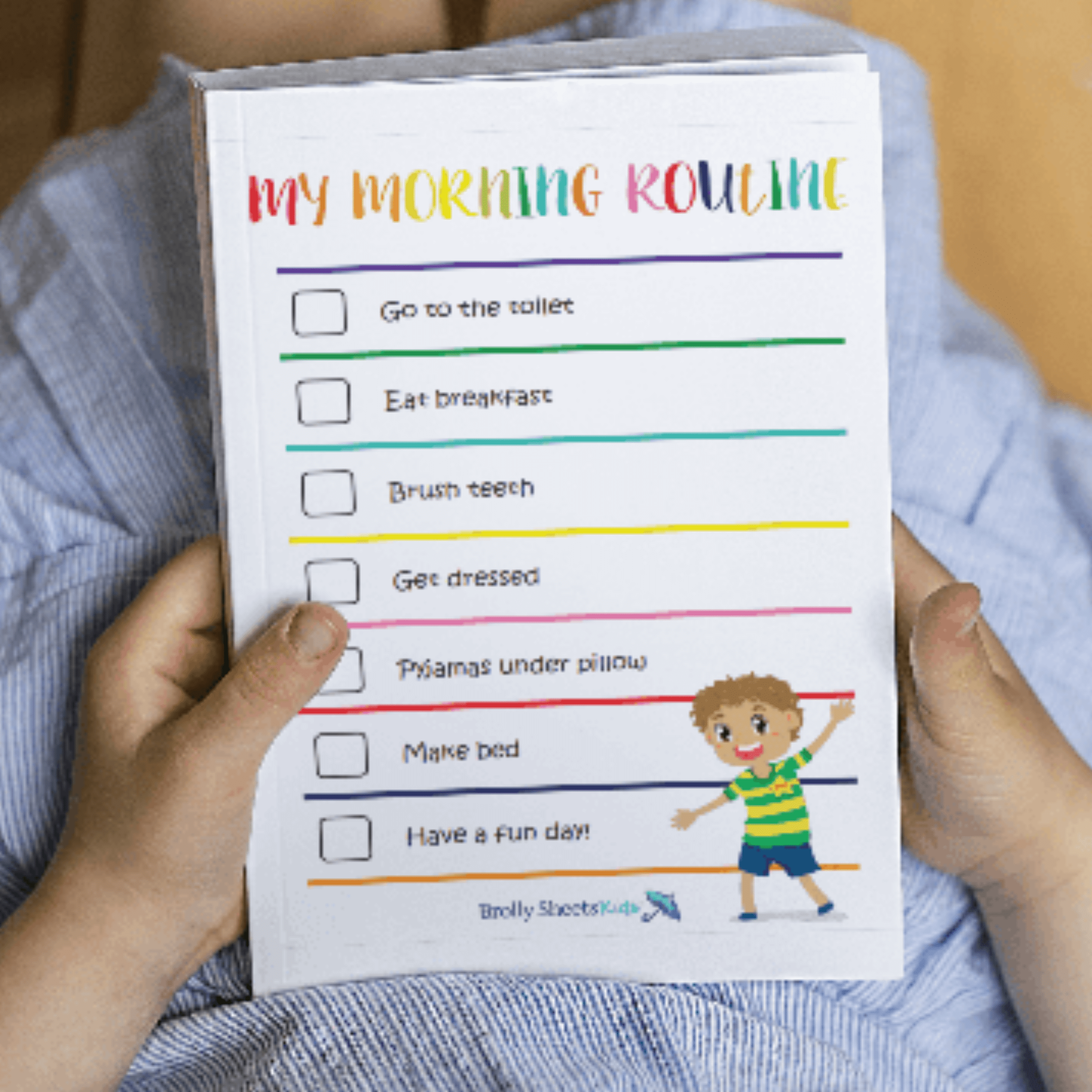 Routine chart being held by young child